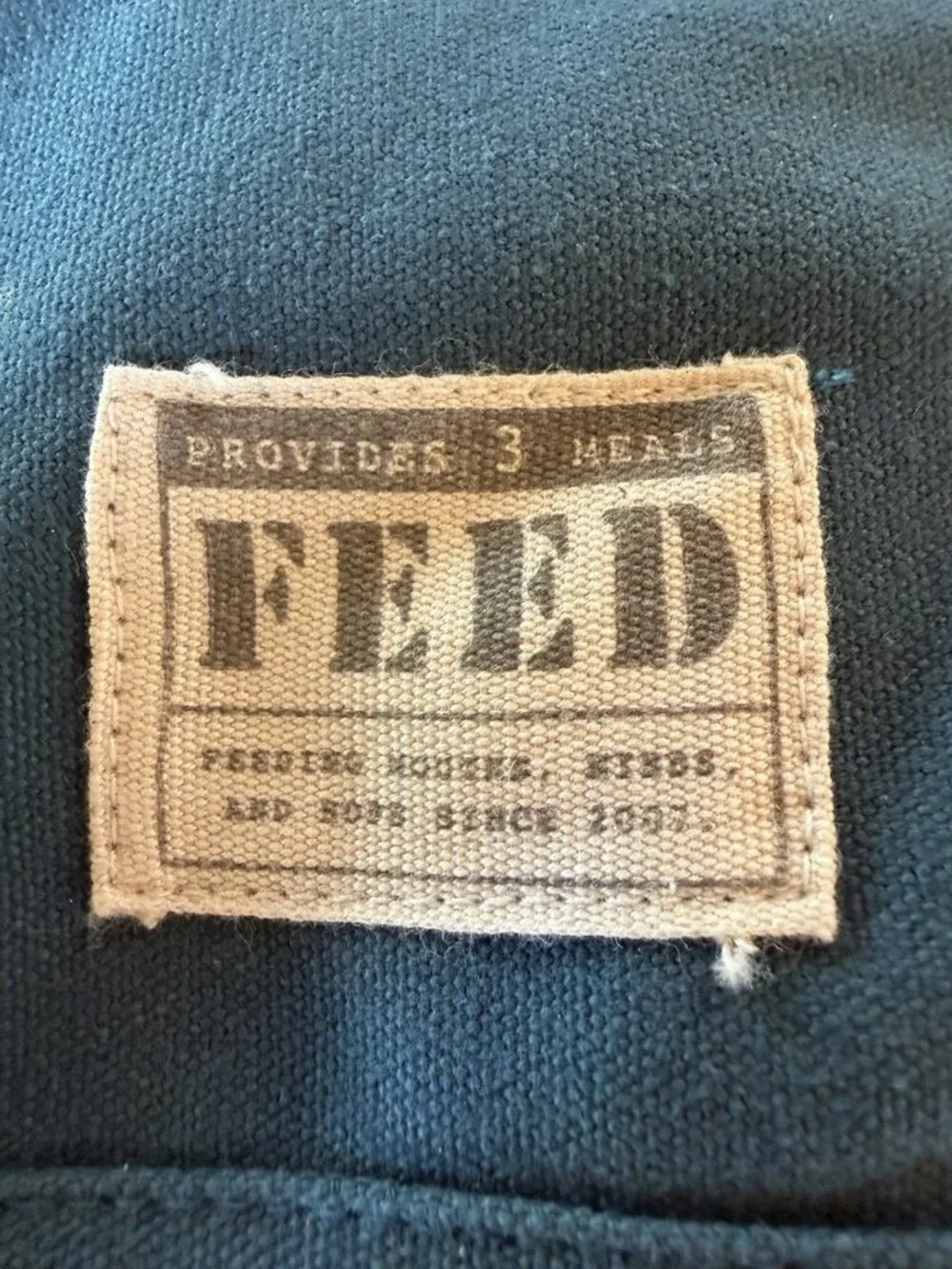 FEED Projects teal double-handle canvas pockets travel academia indie totebag